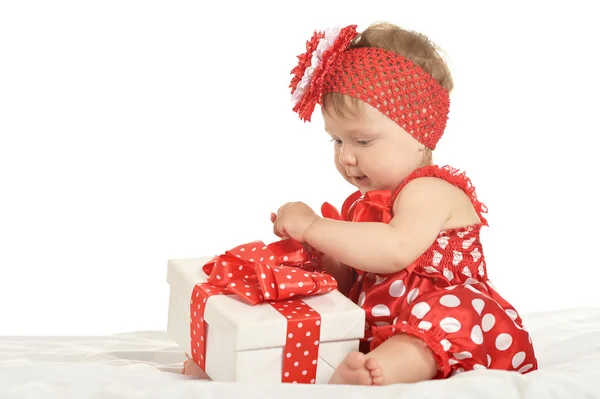 BAby girl in   dress  with gift — Stock fotografie