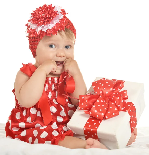BAby girl in   dress  with gift — 图库照片