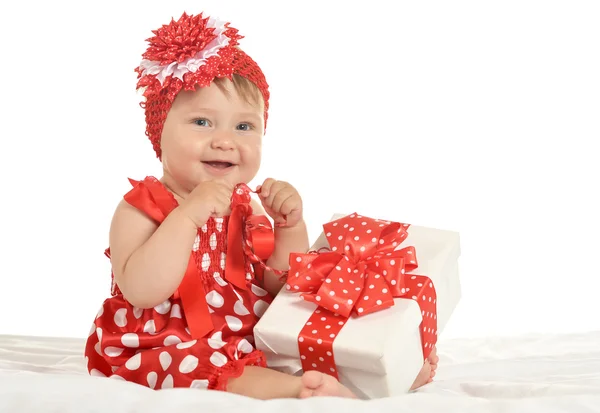 BAby girl in   dress  with gift — 图库照片