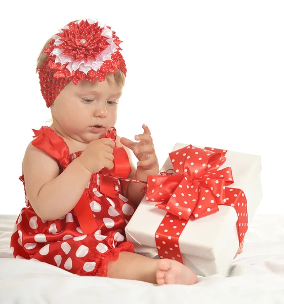 BAby girl in   dress  with gift — 图库照片