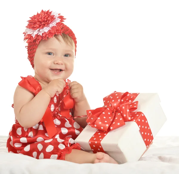 BAby girl in   dress  with gift — 图库照片