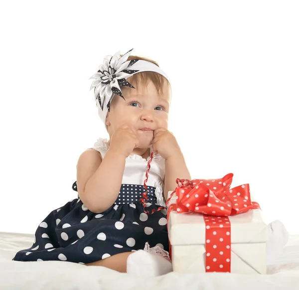 Cute baby girl with gift — 스톡 사진