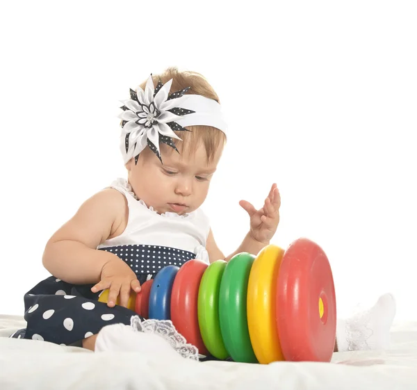 Happy baby girl playing with toys — Stock Photo, Image