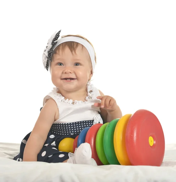Glücklich Baby Mädchen spielt mit Spielzeug — Stockfoto
