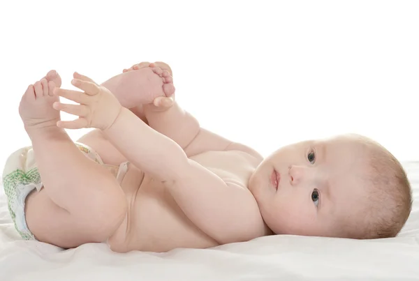 Baby girl lying in pampers — Stock Photo, Image