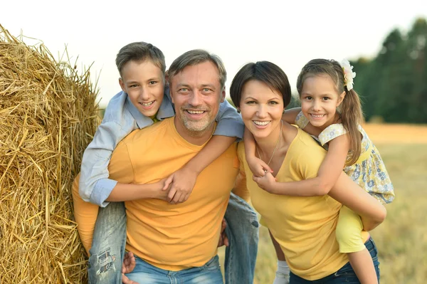 Happy family in wheat field — Stock Photo, Image