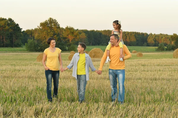 Happy family in wheat field — Stock Photo, Image