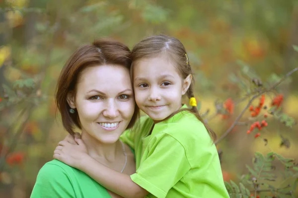 Mother and daughter at garden — Stock Photo, Image