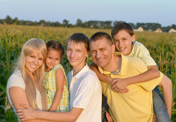 Happy family in wheat field — Stock Photo, Image