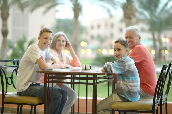 Happy family on the table — Stock Photo, Image