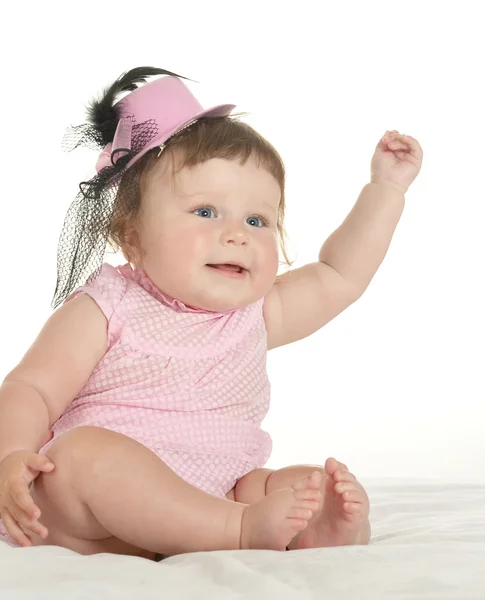 Schattige babymeisje in roze kleding — Stockfoto