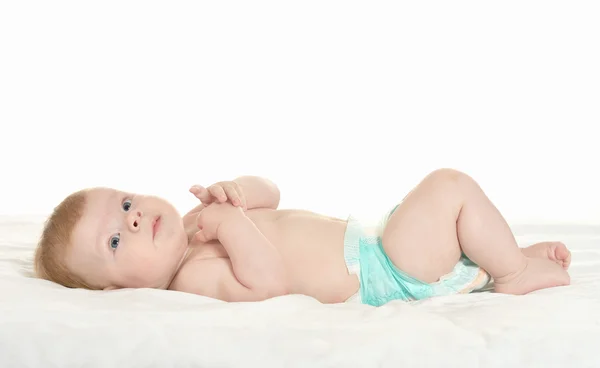 Adorable baby boy in pampers Stock Photo