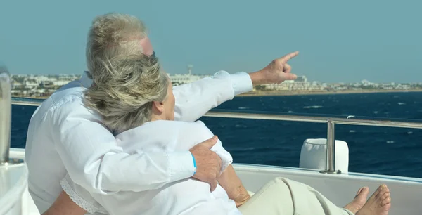 Elderly couple in boat on sea — Stock Photo, Image