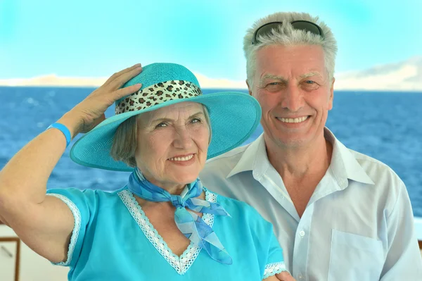 Elderly couple in boat on sea — Stock Photo, Image