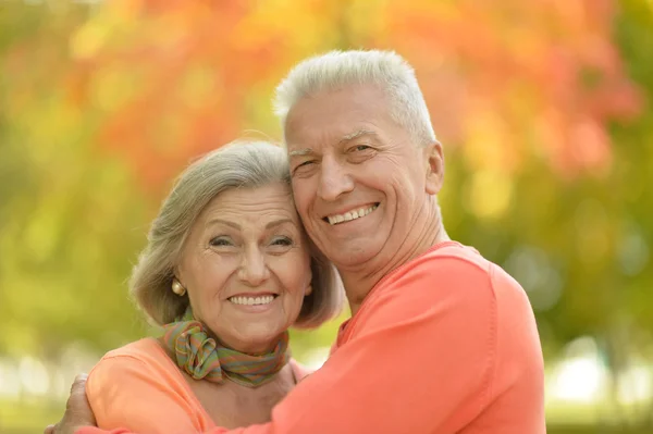 Senior couple at autumn park — Stok fotoğraf