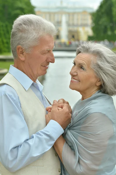 Senior couple at autumn park — Stok fotoğraf