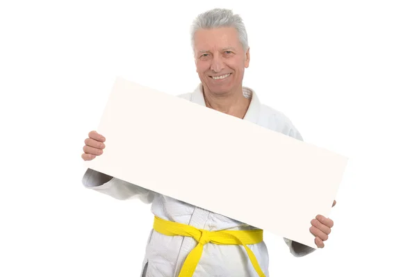 Karate Senior man met poster — Stockfoto