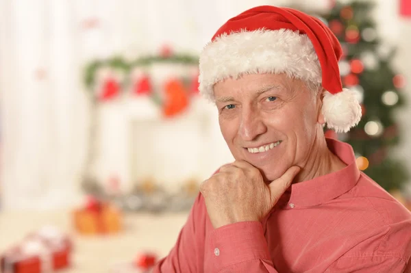 Senior man wearing Christmas cap — Stock Photo, Image