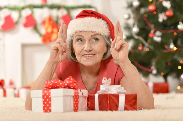 Senior woman with   gifts — Stock Photo, Image