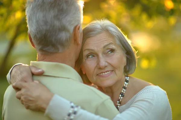 Senior couple in autumn park — Stock Photo, Image