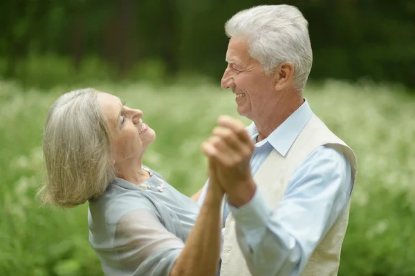 Mature couple dancing in  park — Stock Photo, Image