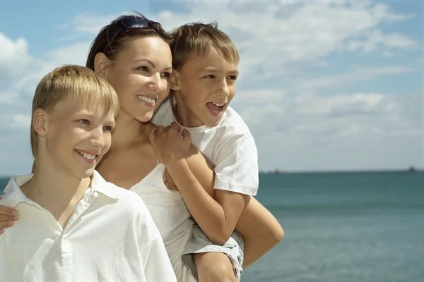 Mother and boys at sea — Stock Photo, Image
