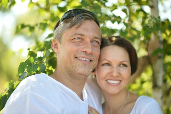 Young family in summer park — Stock Photo, Image