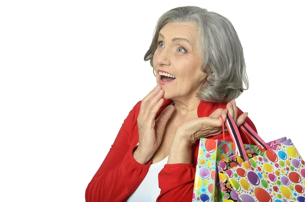 Senior woman with shopping bags — Stock Photo, Image