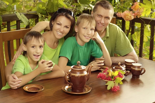 Friendly family drinking tea — Stock Photo, Image