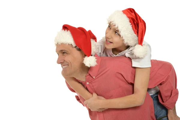 クリスマス帽をかぶった息子と父 ストック画像