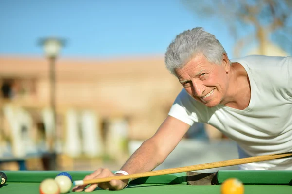 Mature man Playing billiard — Stock Photo, Image