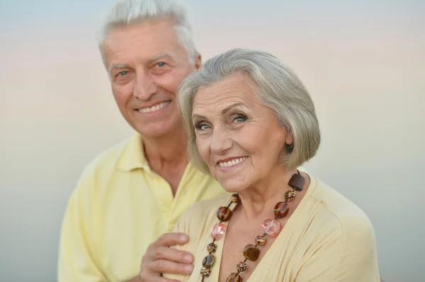 Elderly couple  on the background of sky — Stock Photo, Image