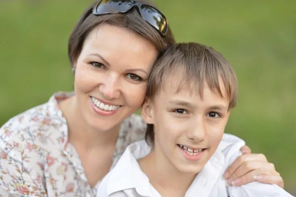 Mother with son in park Royalty Free Stock Photos