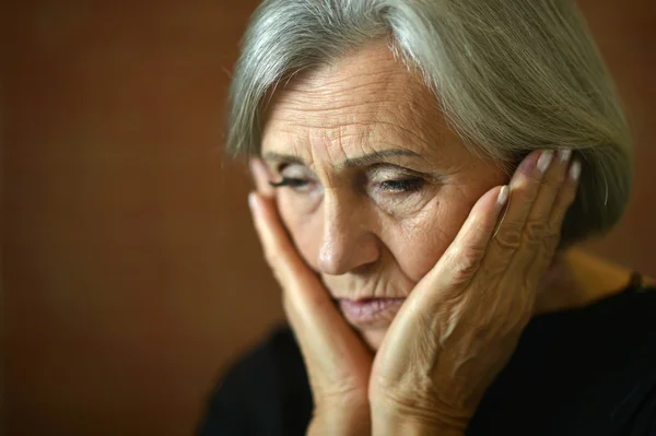 Thoughtful elderly woman — Stock Photo, Image