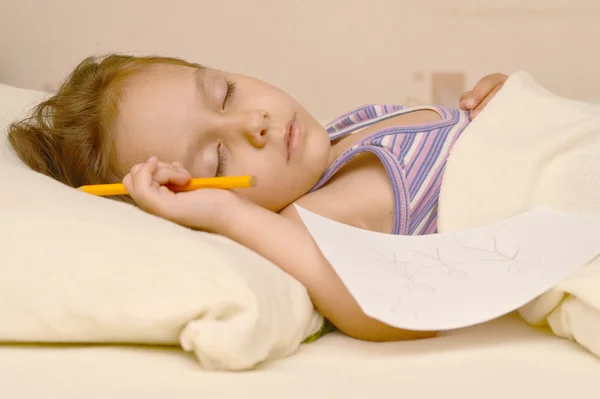 Little girl sleeping with picture — Stock Photo, Image