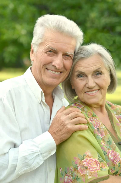 Mature couple   in summer park — Stock Photo, Image