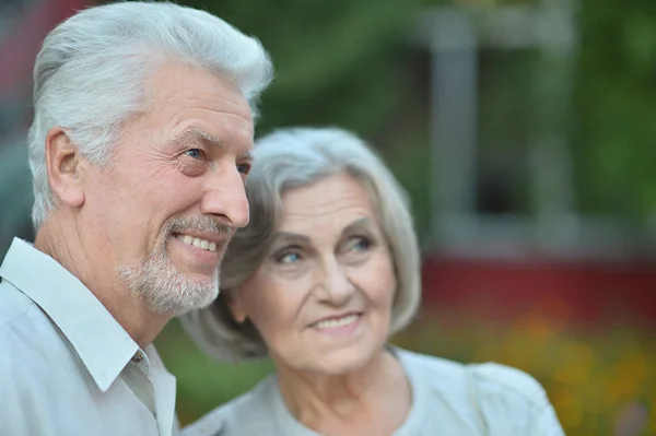 Mature couple   in summer park — Stock Photo, Image