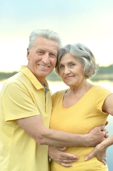 Happy senior couple  near river — Stock Photo, Image