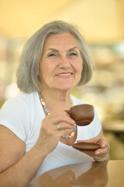 Senior woman with cup of coffee — Stock Photo, Image