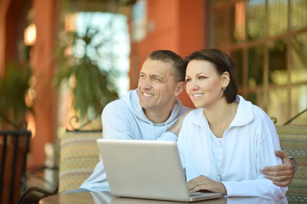 Happy couple with laptop Stock Image
