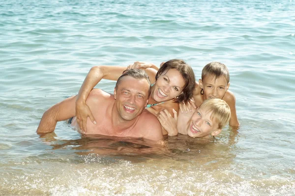Happy family at beach — Stock Photo, Image