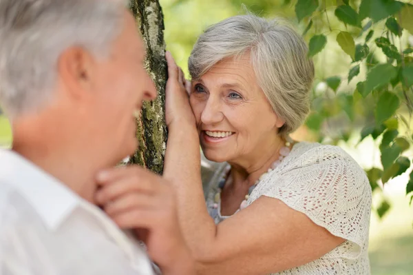 Mature couple on a walk in the park — Stock Photo, Image