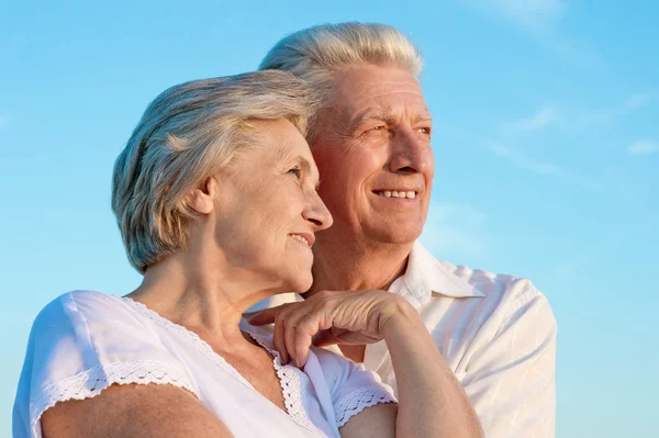 Elderly couple  on the background of sky — Stock Photo, Image