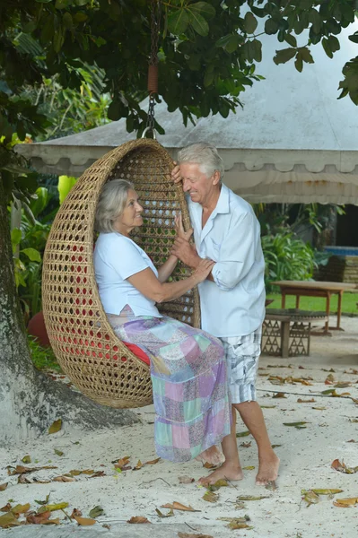 Elderly couple  in tropical garden — Stock Photo, Image