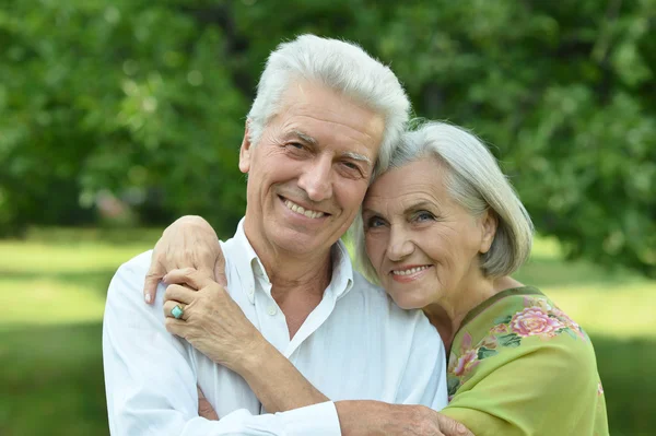 Mature couple   in summer park — Stock Photo, Image