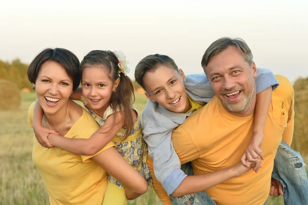 Happy family at   field — Stock Photo, Image