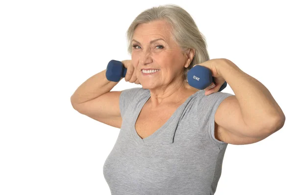 Senior woman exercising with dumbbells — Stock Photo, Image