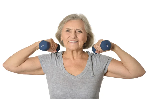 Senior woman exercising with dumbbells — Stock Photo, Image