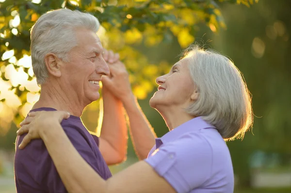 Mature couple   in summer park — Stock Photo, Image