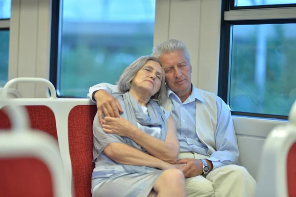 Senior couple in train — Stock Photo, Image